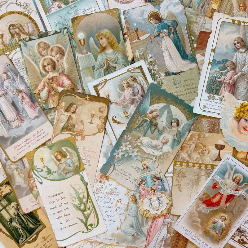 守護天使などが美しく描かれたホーリーカードです。聖体拝領や巡礼の記念で、裏面の直筆文字にもご注目ください。