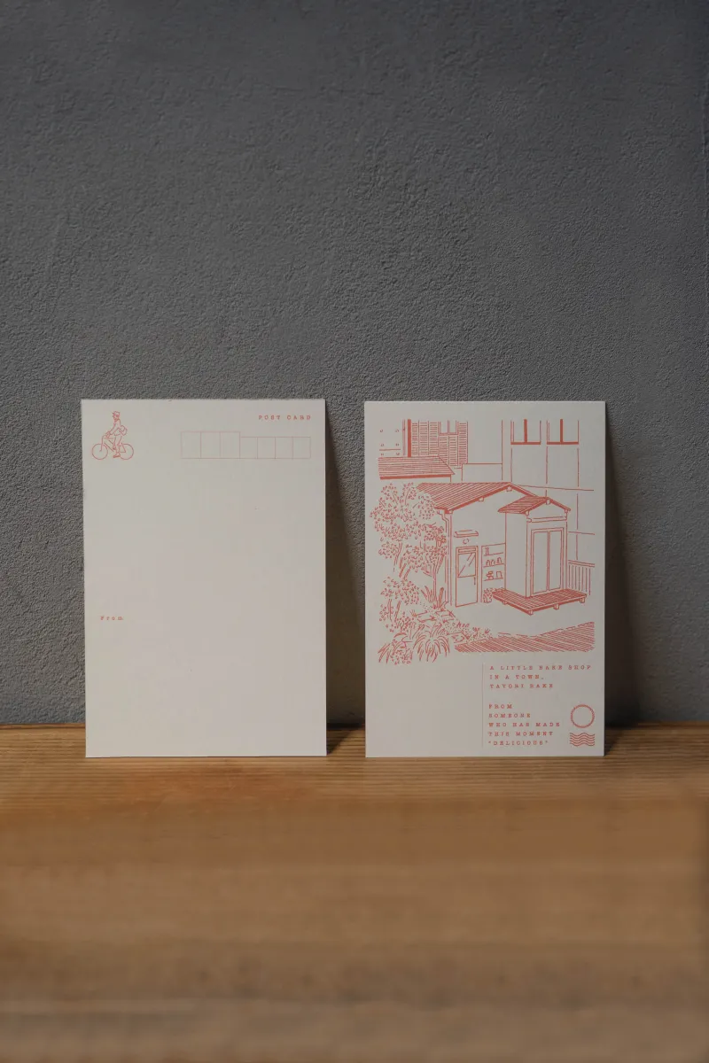 谷中の工房の外観をモチーフに、お店の空気ごと届けるような葉書も缶の中に入ってます。